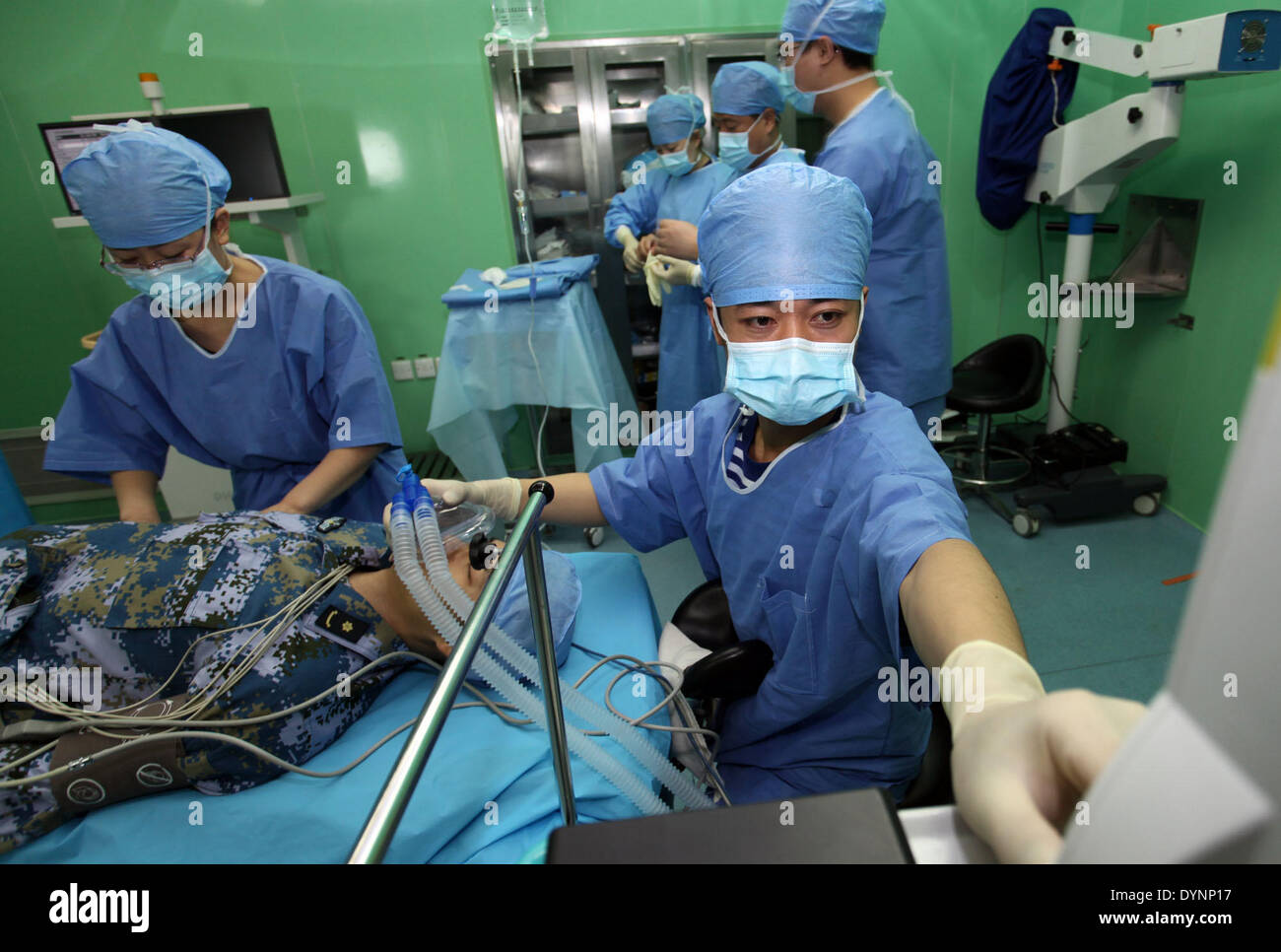 Qingdao, China's Shandong Province. 23rd Apr, 2014. Medical staff members provide survey for the 'wounded' during the multi-country maritime exercises off the coast of Qingdao, east China's Shandong Province, April 23, 2014. Nineteen ships, seven helicopters and marine corps from eight countries including China, Bangladesh, Pakistan, Singapore, Indonesia, India, Malaysia and Brunei were organized into three task forces to conduct the exercises dubbed 'Maritime Cooperation - 2014'. Credit:  Huang Yuping/Xinhua/Alamy Live News Stock Photo