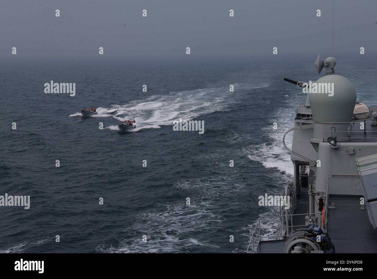 Qingdao. 23rd Apr, 2014. Photo taken on April 23, 2014 shows the scene of the multi-country maritime exercises off the coast of Qingdao, east China's Shandong Province. Nineteen ships, seven helicopters and marine corps from eight countries including China, Bangladesh, Pakistan, Singapore, Indonesia, India, Malaysia and Brunei were organized into three task forces to conduct the exercises dubbed 'Maritime Cooperation - 2014'. Credit:  Wang Jianmin/Xinhua/Alamy Live News Stock Photo