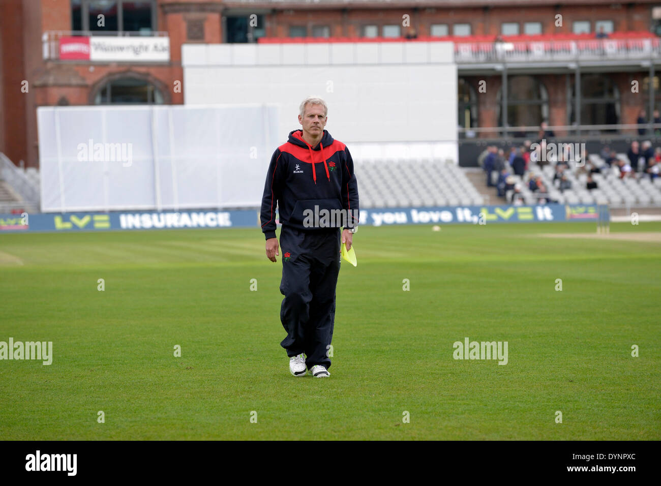 Manchester, UK. 23rd Apr, 2014. Peter Moores, the head coach at Lancashire County Cricket Club walks across the ground on the morning of the final day of the match against Warwickshire before taking up his new post as manager of the England Cricket Team. Peter Moores Last Match As Lancashire Coach Manchester, UK 23rd April 2014 Credit:  John Fryer/Alamy Live News Stock Photo