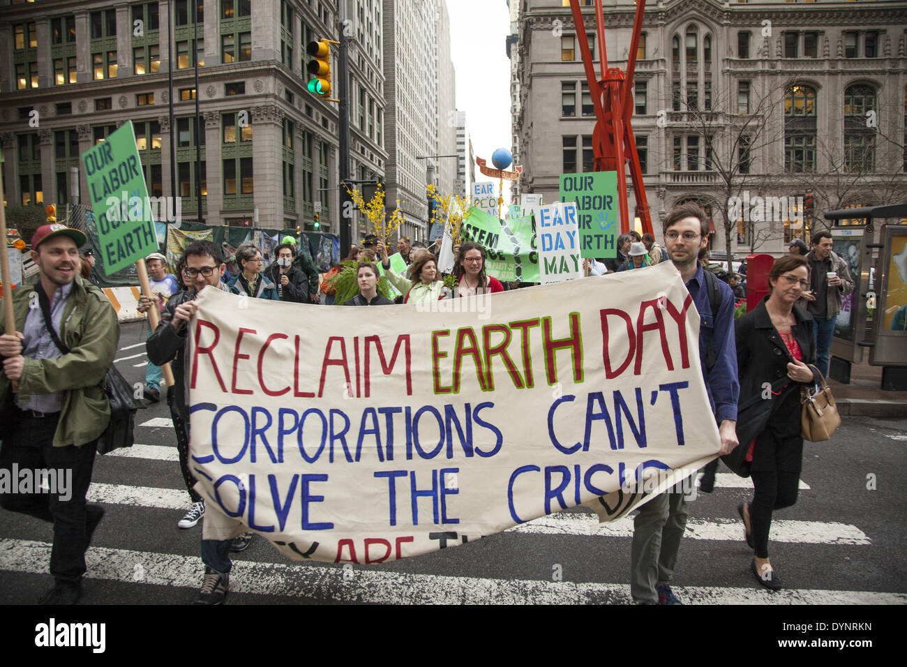 New York, NY, USA . 22nd Apr, 2014. Environmental activists rally on Earth Day at Zuccotti Park, then march to Wall Street calling for system change not climate change. The Occupy movement is still around in NYC it seems. Credit:  David Grossman/Alamy Live News Stock Photo