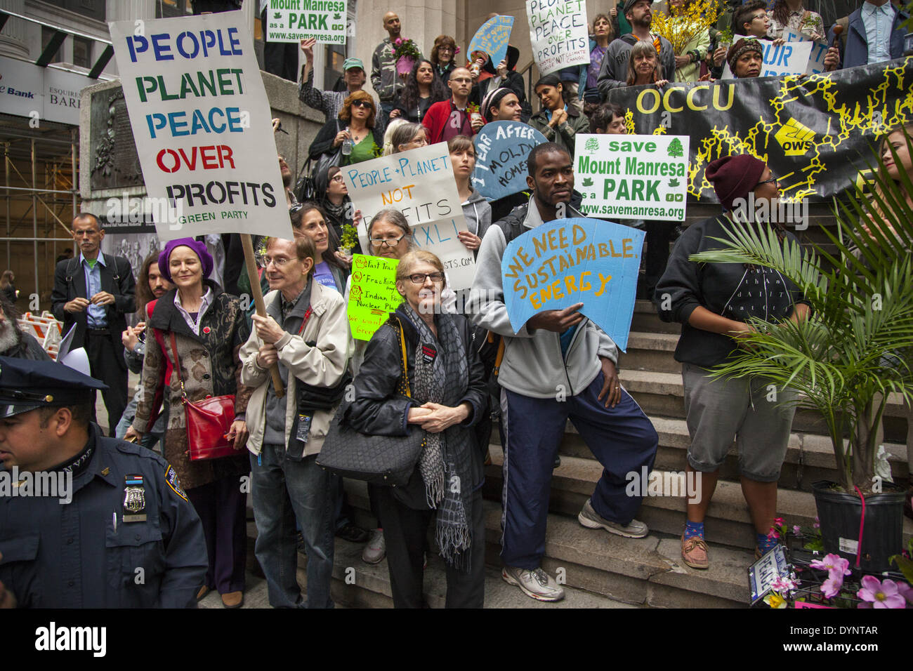 New York, NY, USA , 22nd Apr, 2014. Environmental activists rally on Earth Day at Zuccotti Park, then march to Wall Street calling for system change not climate change. The Occupy movement is still around in NYC it seems. Credit:  David Grossman/Alamy Live News Stock Photo