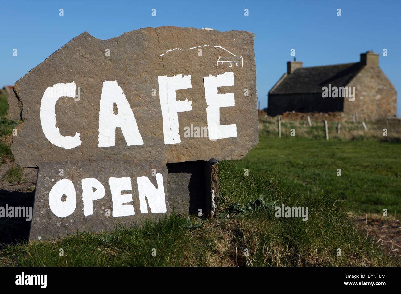 Cafe Open sign painted onto a rock on the Orkney island of Hoy Stock Photo