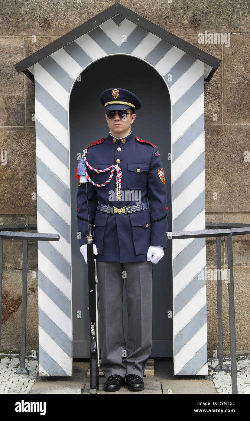 A guard in front of Prague Castle entrance guarding the Castle wearing the specific uniform for the Guards. Stock Photo