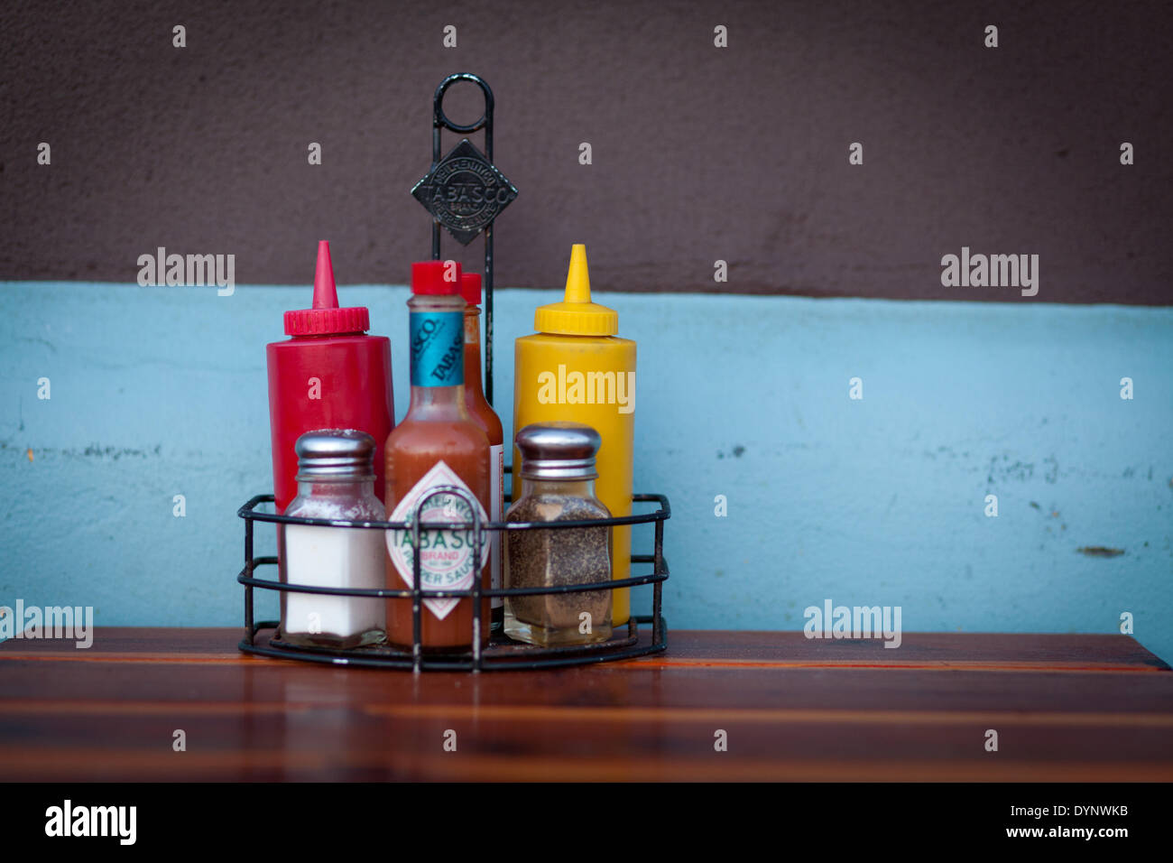 Spices, ketchup and mustard containers at a fast foodrestaurant, in