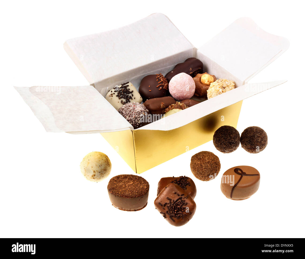 A CUTOUT OF AN OPEN GOLD BOX OF ASSORTED TRUFFLE CHOCOLATES Stock Photo
