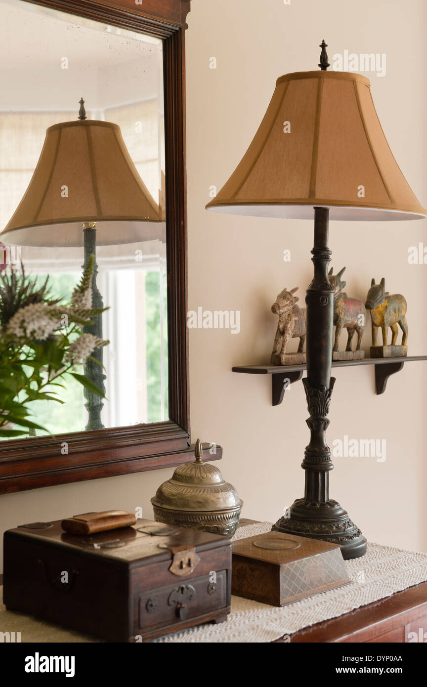 group of objects with lamp, mirror, and jewelery box Stock Photo