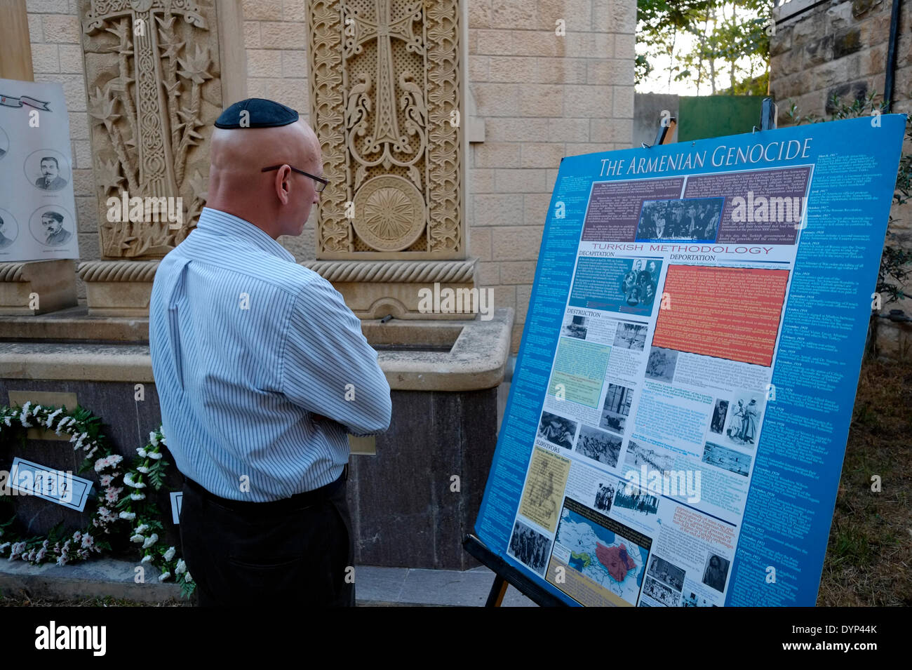 An Israeli religious Jew reads about the Armenian Genocide at the Armenian Genocide memorial on the eve of 99th anniversary of Armenian Genocide at the Armenian Patriarchate in the Armenian quarter Old city East Jerusalem Israel on 23  APRIL 2014. Genocide Remembrance Day or Genocide Memorial day, is observed by Armenians in dispersed communities around the world on April 24 . It is held annually to commemorate the victims of the Armenian Genocide from 1915 to 1923. Stock Photo