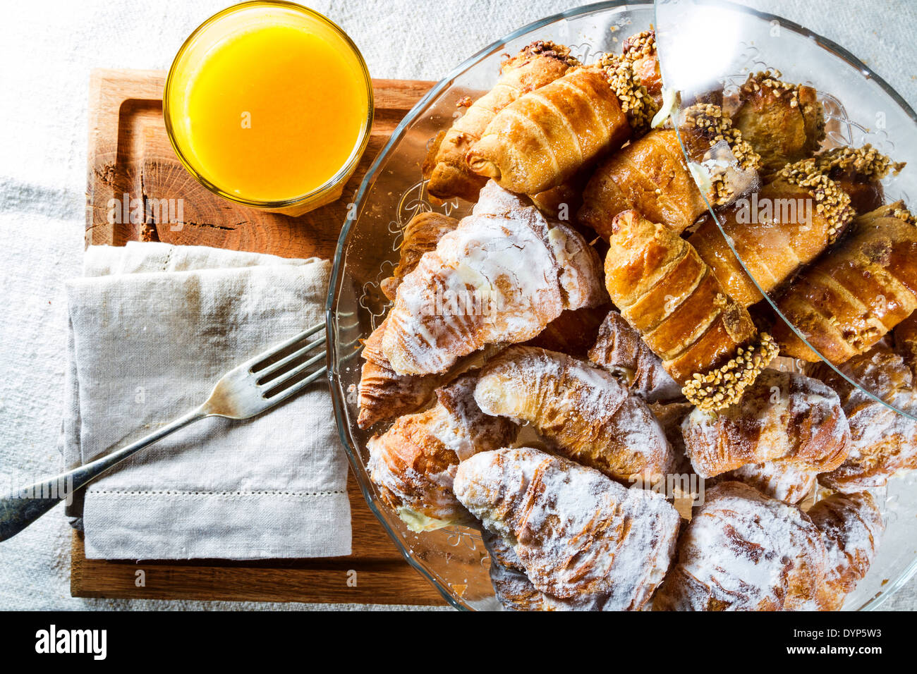 Typical continental breakfast with sugarcoated cannoli and croissants