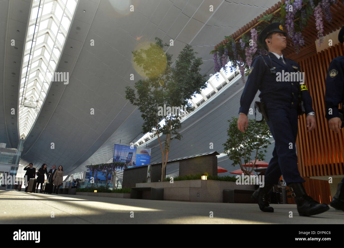 Ota, Tokyo, Japan. 23rd Apr, 2014. A Japanese police officer walks along the International Passenger Terminal Area at the Haneda Airport. The U.S. President s expected to arrive in Japan today. © Agustin Tabares/ZUMA Wire/ZUMAPRESS.com/Alamy Live News Stock Photo
