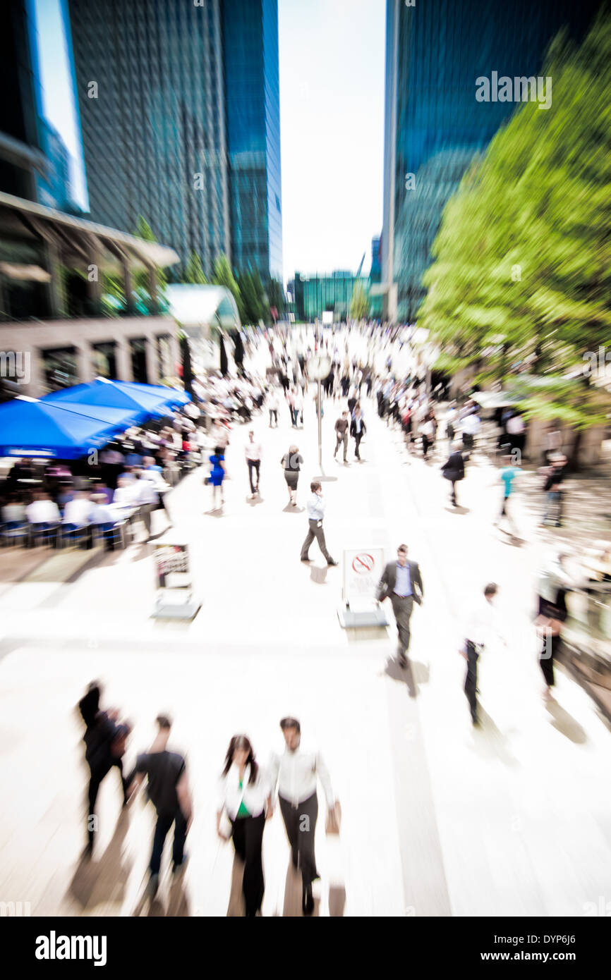 Zoom on business people rushing around at Canary Wharf, London. Motion blur. Stock Photo