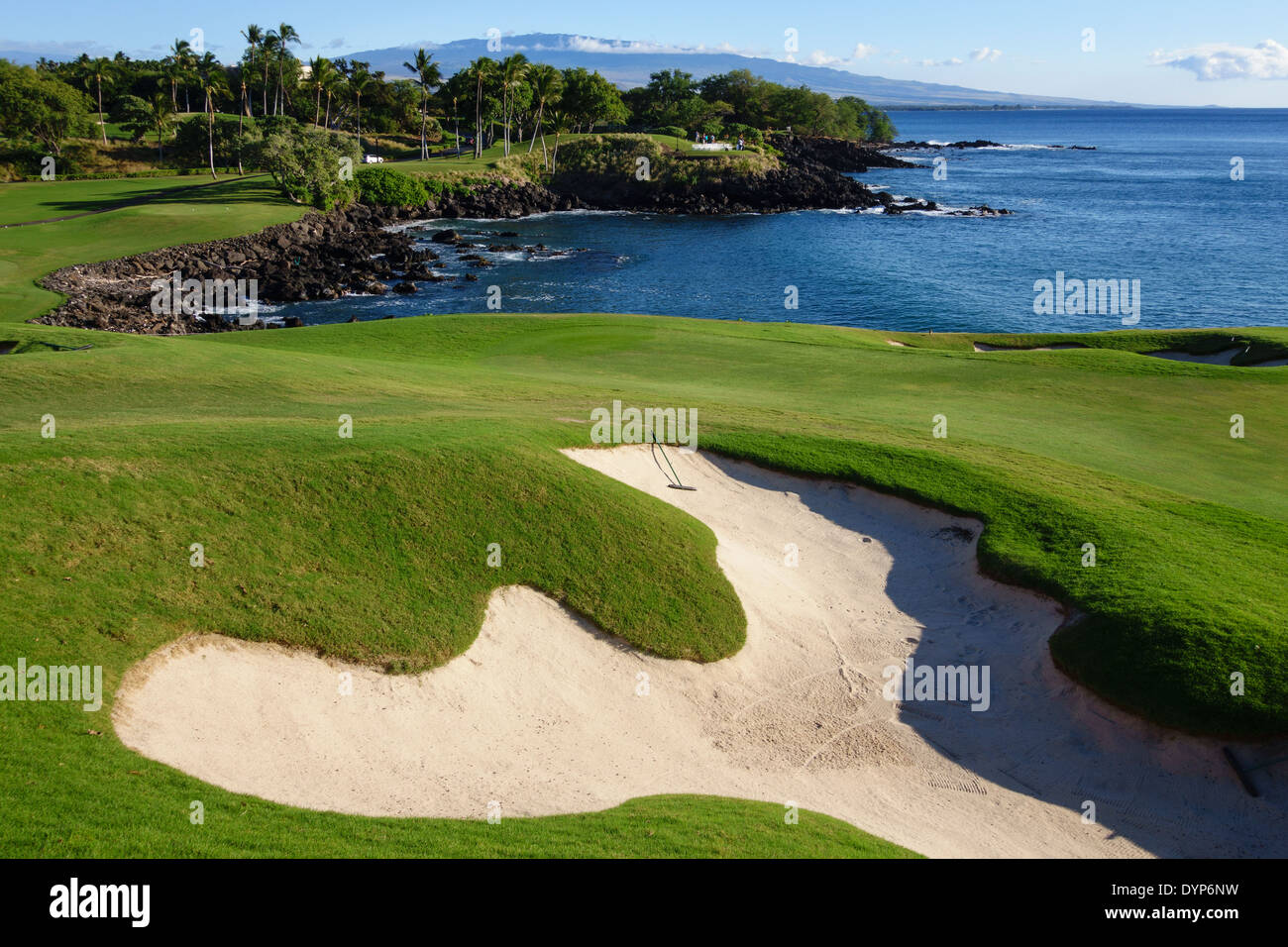 Signature third hole of Mauna Kea golf course in Hawaii with Hualalai