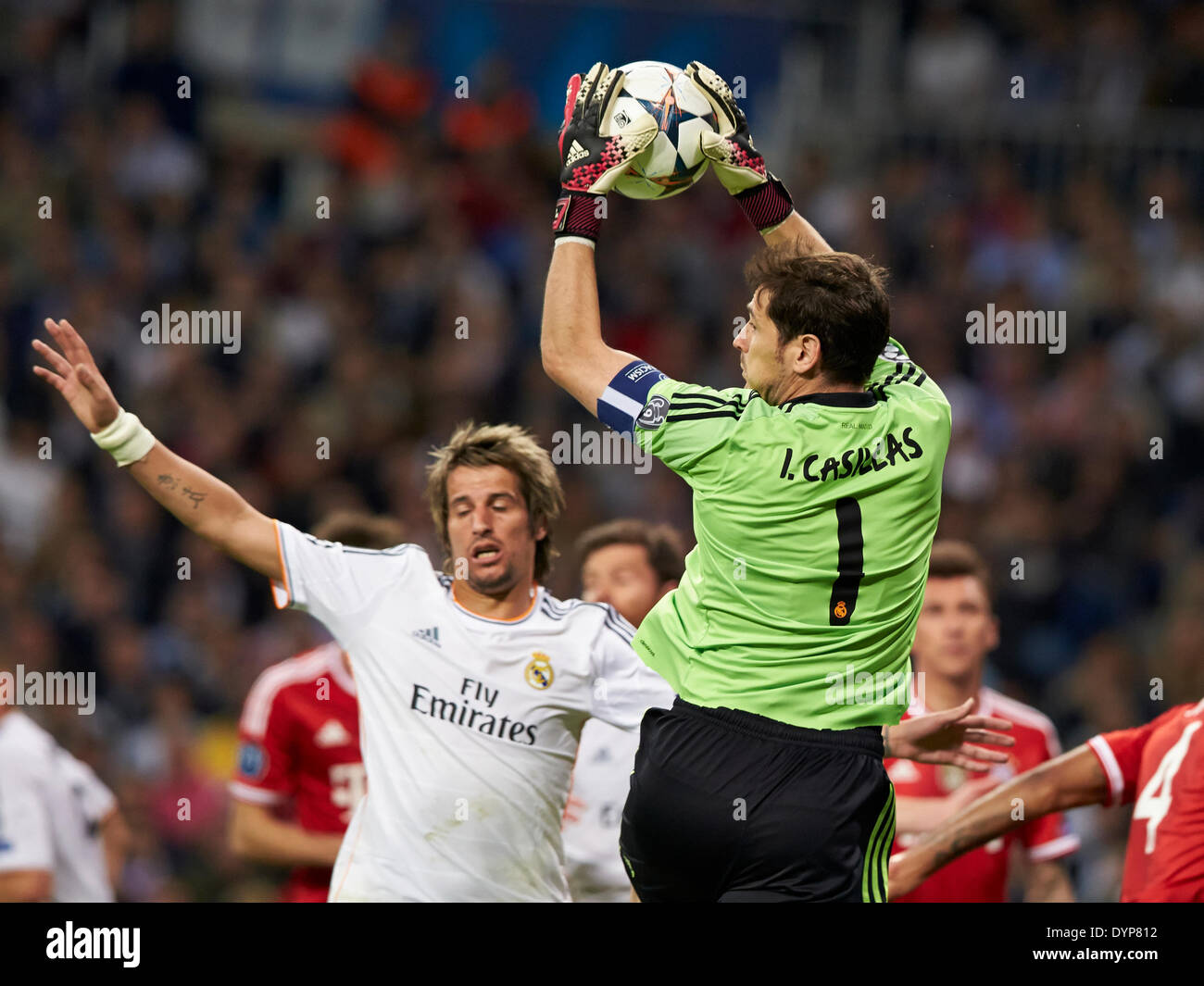 Madrid, Spain. 23rd Apr, 2014. Goal Keeper Iker Casillas of Real Madrid (R) blocks the ball during the UEFA Champions League Game between Real Madrid and FC Bayern Munich at Santiago Bernabeu Stadium, Valencia Credit:  Action Plus Sports/Alamy Live News Stock Photo