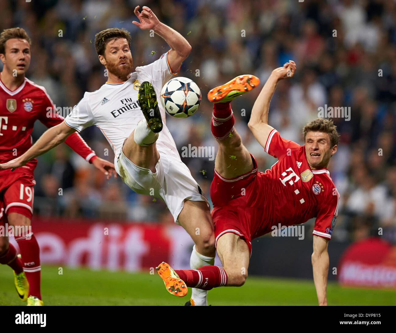 Madrid, Spain. 23rd Apr, 2014. Midfielder Xabi Alonso of Real Madrid (L) duels for the ball with Thomas MULLER during the UEFA Champions League Game between Real Madrid and FC Bayern Munich at Santiago Bernabeu Stadium, Valencia Credit:  Action Plus Sports/Alamy Live News Stock Photo