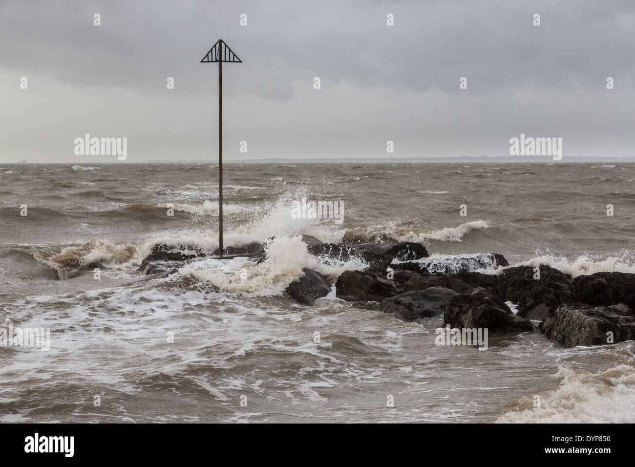 Rough sea and waves breaking on rocks in stormy bad weather at Lee On Solent, Hampshire, UK Stock Photo