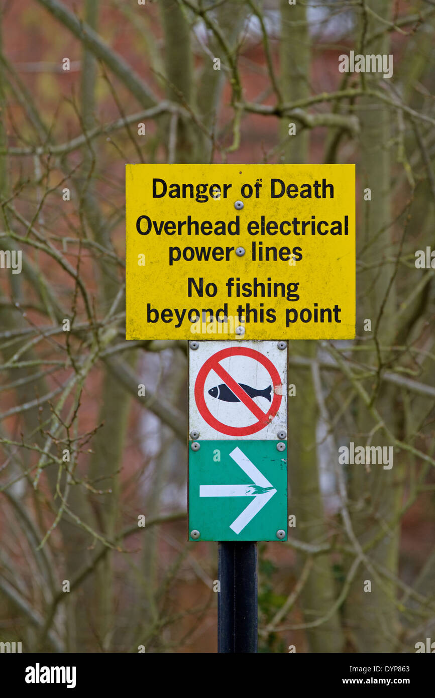 Danger overhead power lines sign. No fishing. UK Stock Photo