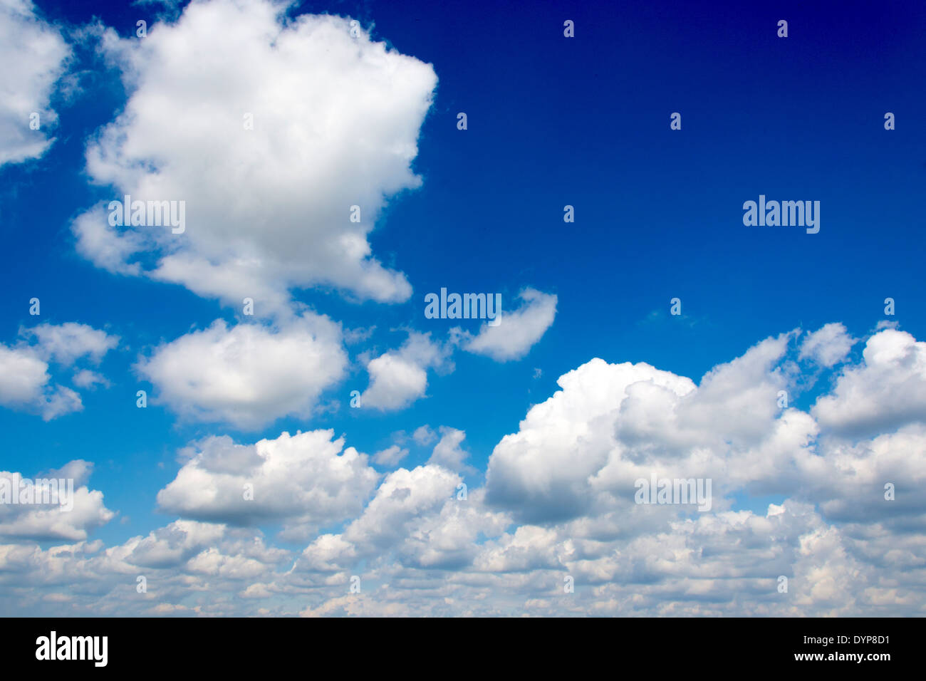 Fluffy white clouds and dark blue sky as background Stock Photo - Alamy