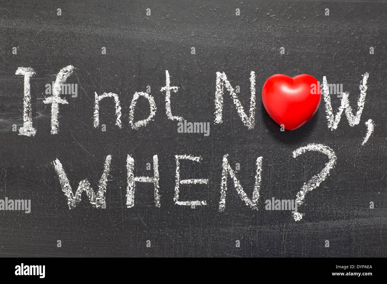 if not now, when question handwritten on chalkboard with heart symbol instead of O Stock Photo