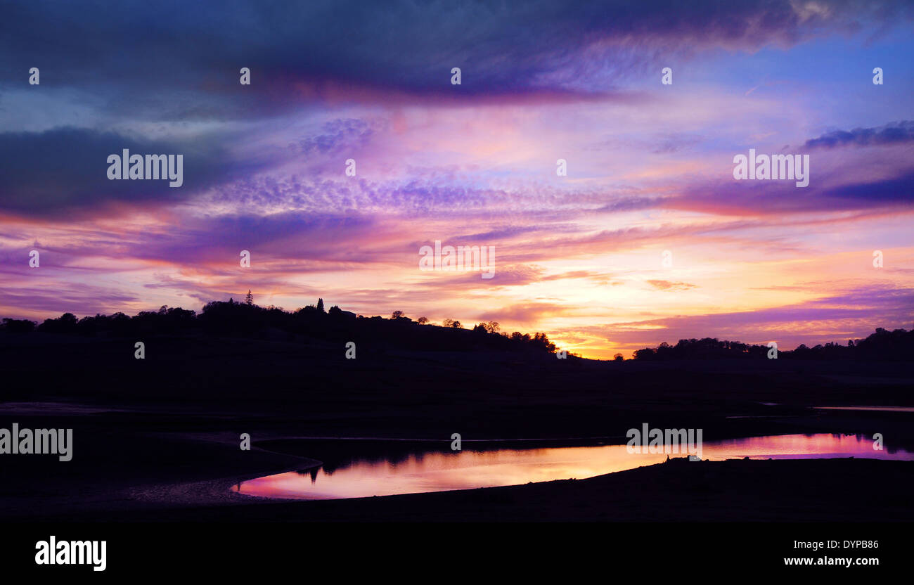 Sunset over water at Mormon village in Folsom, California Stock Photo