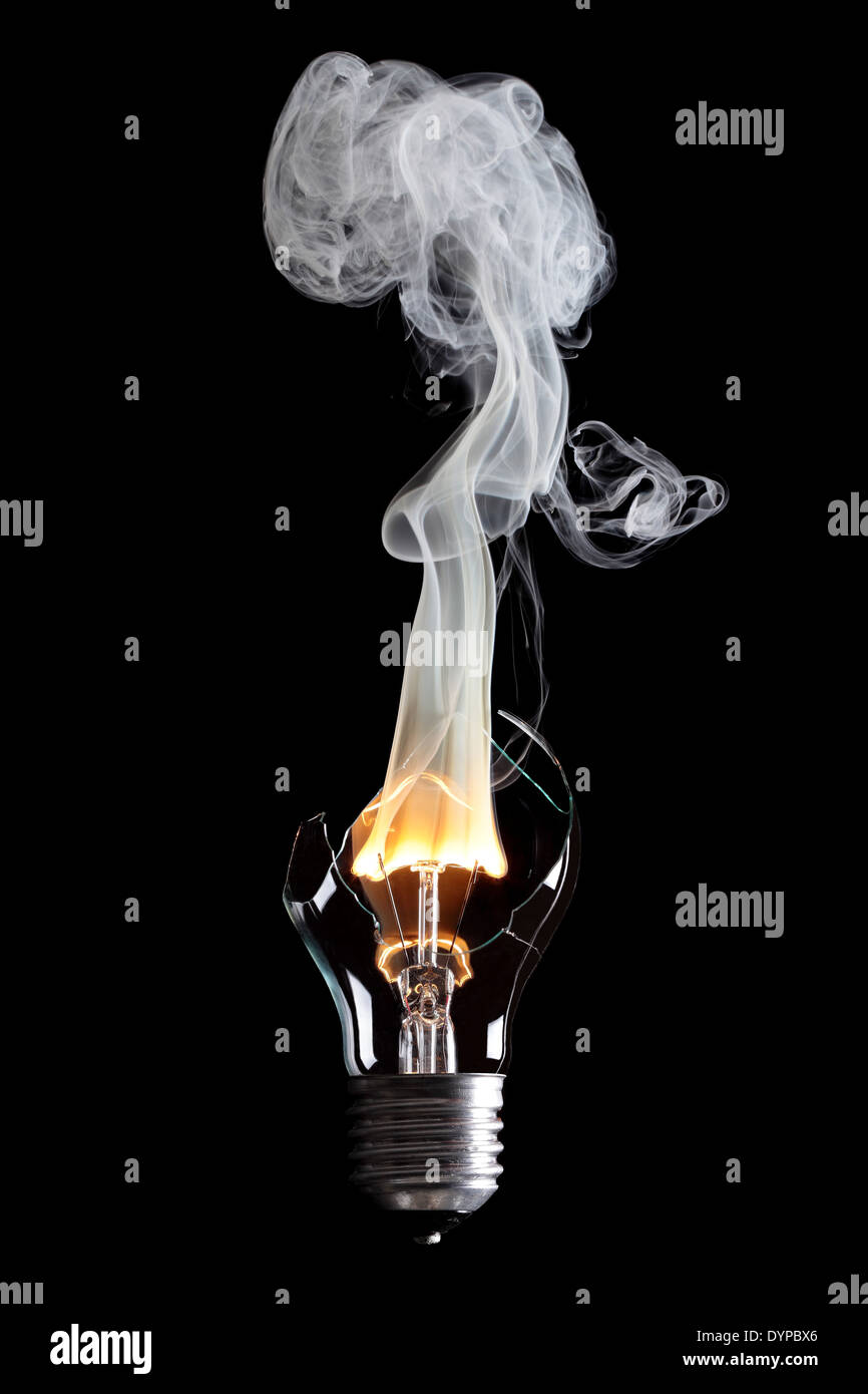 bulb exploding with fire and smoke Stock Photo Alamy