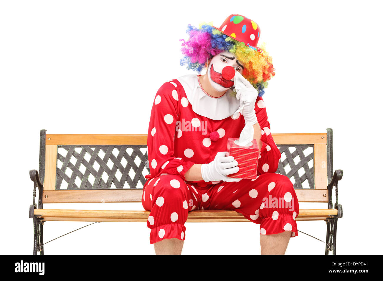 Sad clown wiping his eyes from crying Stock Photo