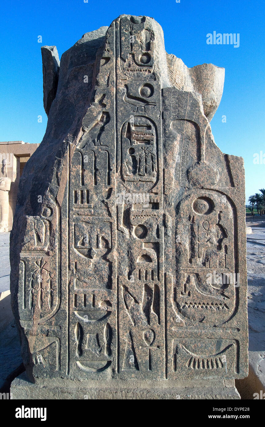 Ramesseum : the funeral temple of pharaoh Ramses II the Great(1303-1213 b.C. XIX dyn.). The back of a statue with a cartouche. Stock Photo