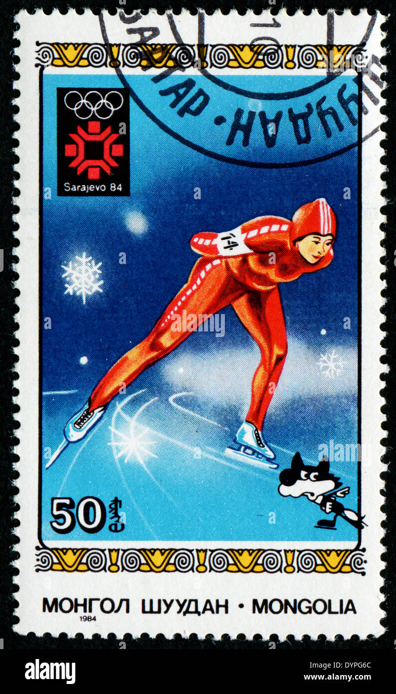 MONGOLIA - CIRCA 1984: A stamp printed in Mongolia showing skater, Olympic Games in Los Sarajevo circa 1984 Stock Photo