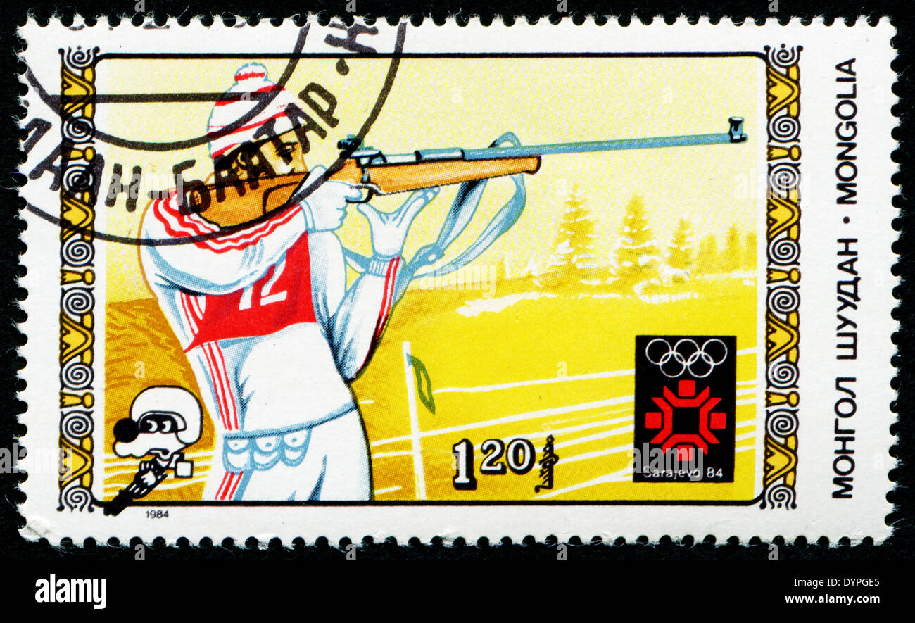 MONGOLIA - CIRCA 1984: A stamp printed in Mongolia showing biathlon, Olympic Games in Los Sarajevo circa 1984 Stock Photo