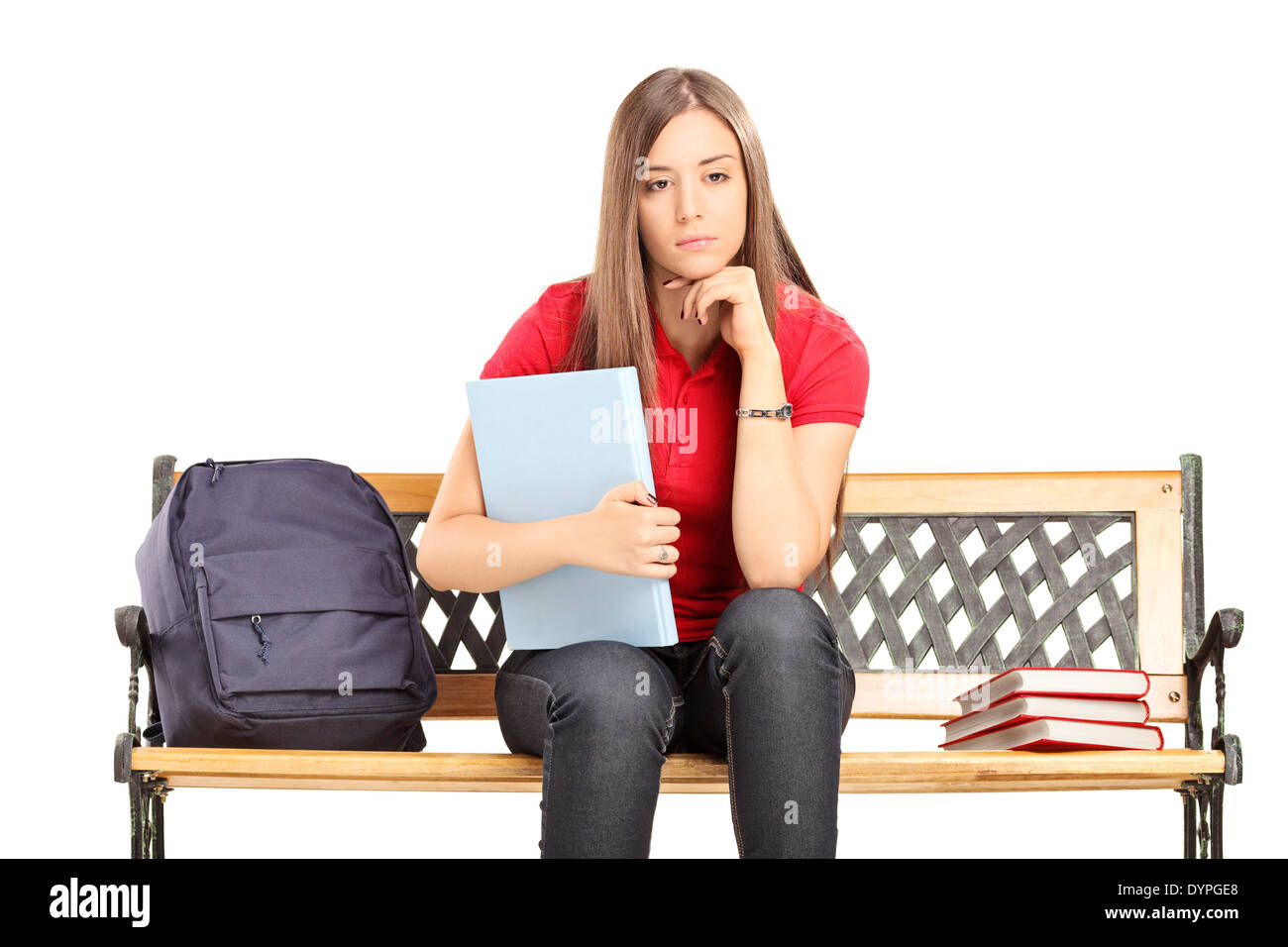 Female student contemplating seated on a bench Stock Photo - Alamy