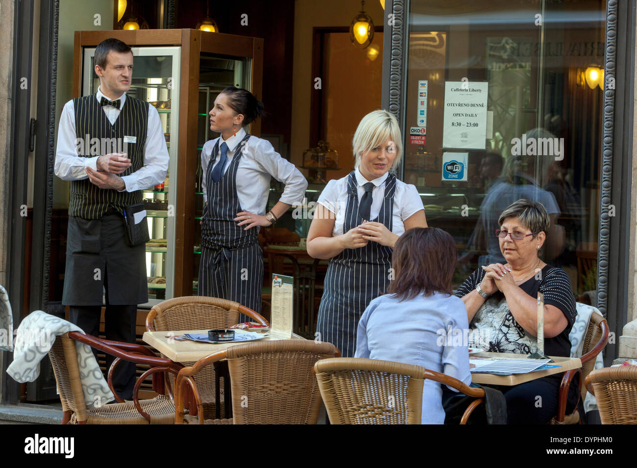 Prague cafe, waitress and tourists on the pedestrian zone, Prague Old Town Czech Republic Stock Photo
