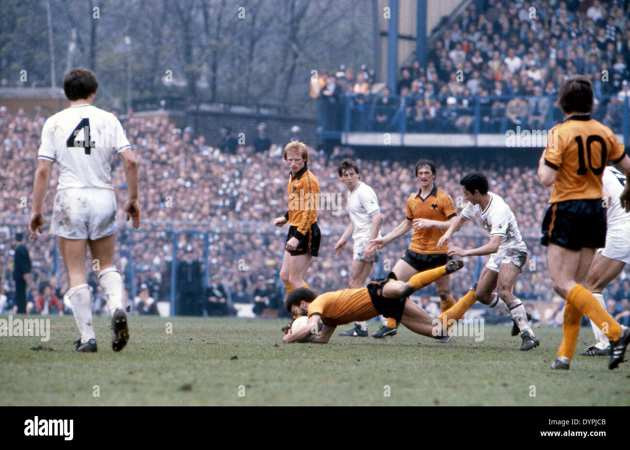 Footballer George Berry fouled by Ossie Ardiles watched by Willie Carr ...