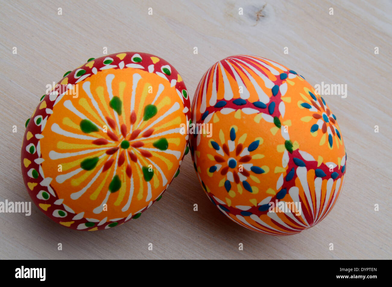 handpainted eastereggs on a wooden table Stock Photo