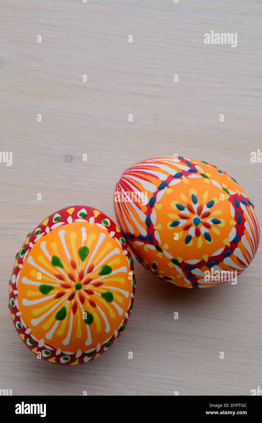 handpainted eastereggs on a wooden table Stock Photo