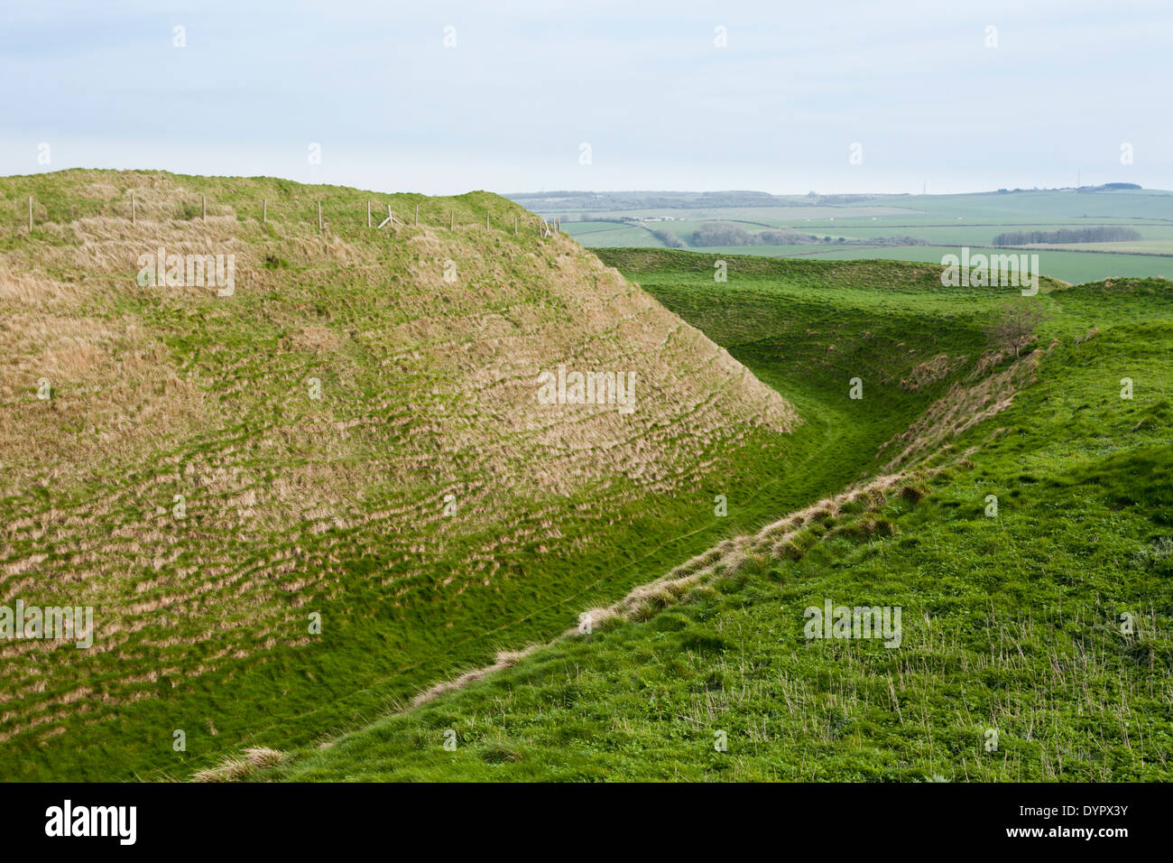 One of the many ramparts & ditches of Maiden Castle, an Iron Age hill fort dating from around 600BC, near Dorchester, Dorset UK Stock Photo