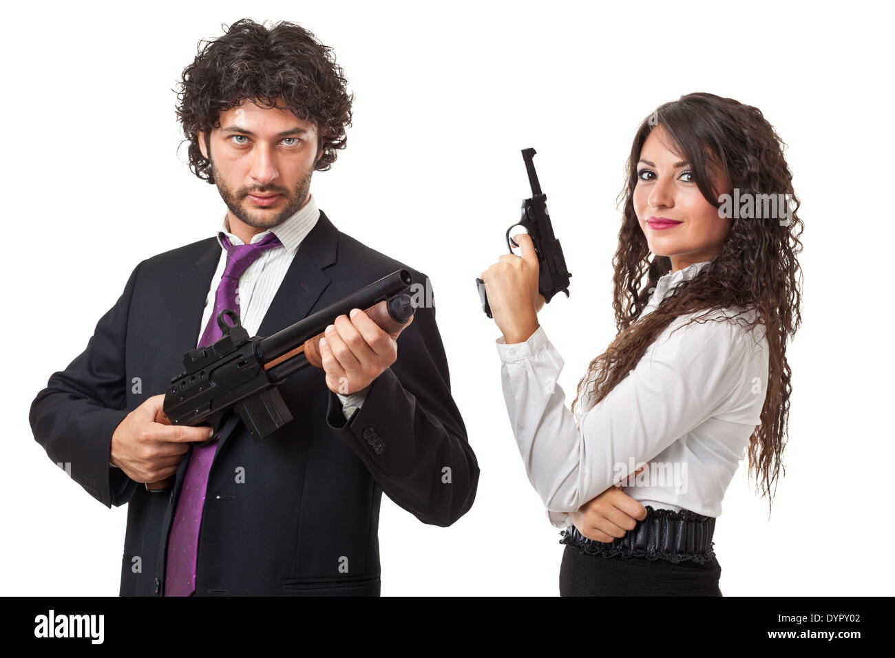 A businessman and a businesswoman (or maybe a couple of spies or gangster) holding guns over a white background Stock Photo