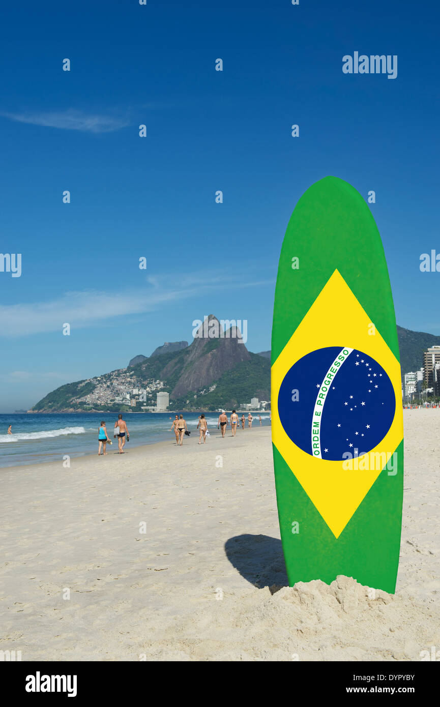 Brazilian flag stand up paddle surfboard standing on the beach at Ipanema, Rio de Janeiro Brazil Stock Photo