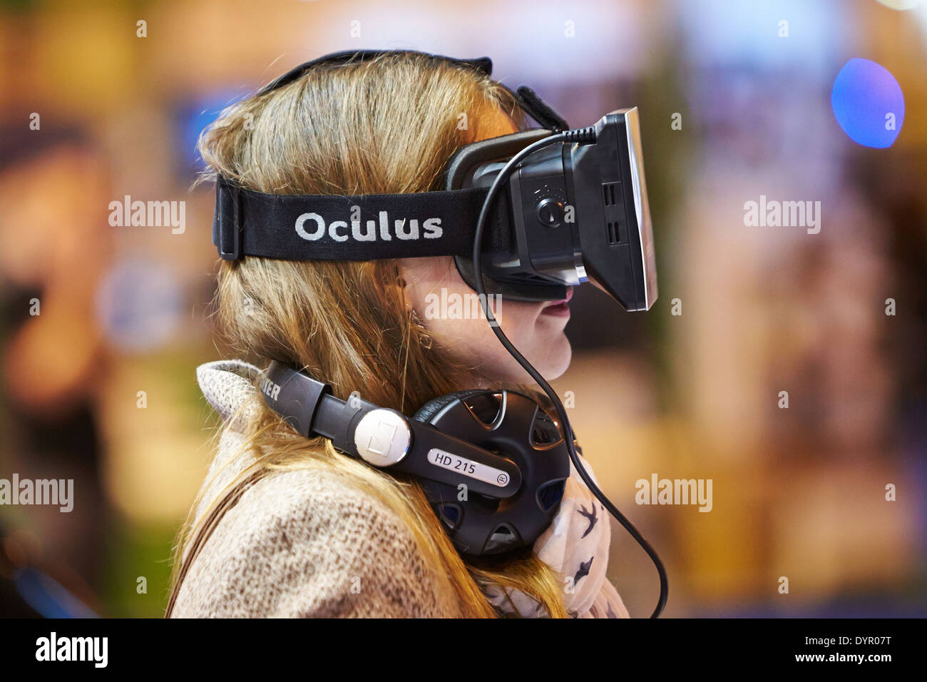 A woman wearing an Oculus Rift virtual reality headset at the Gadget Show Live 2014 at the NEC Stock Photo