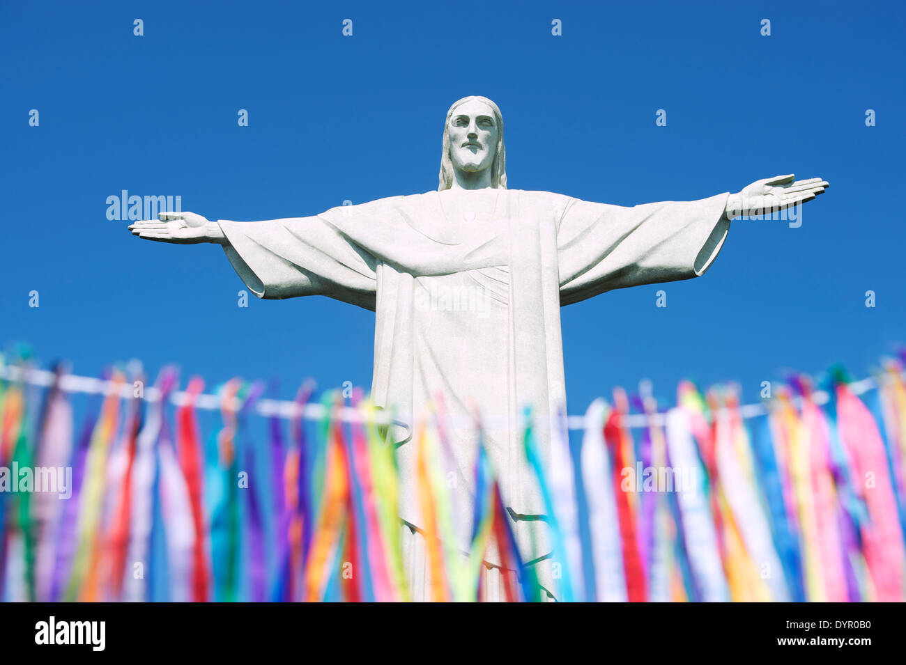 Rio Carnival celebration features colorful Brazilian wish ribbons at statue of Corcovado Stock Photo