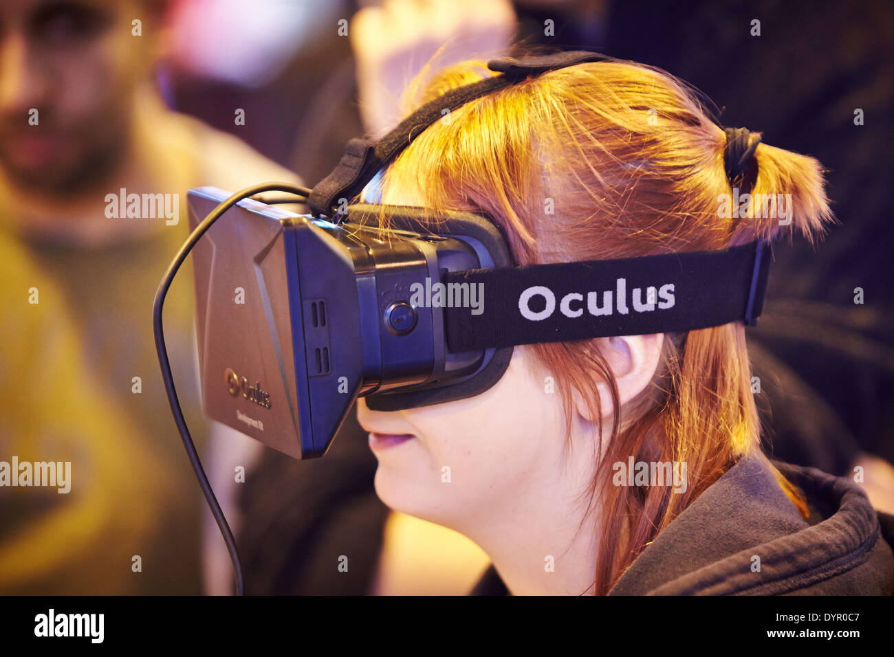 A woman wearing an Oculus Rift virtual reality headset at the Gadget ...
