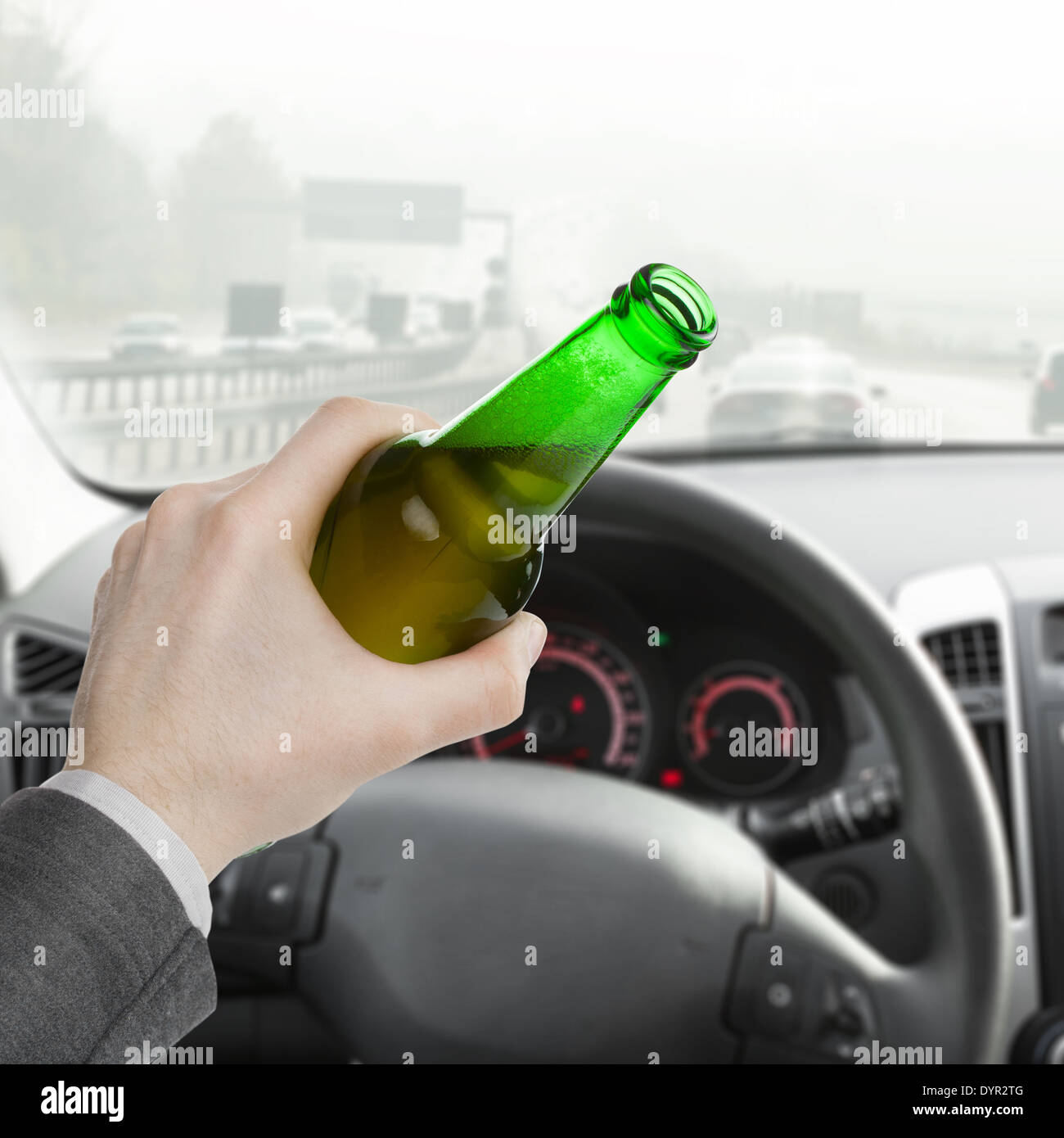 Man holding bottle of beer in his left hand while driving car - 1 to 1 ...