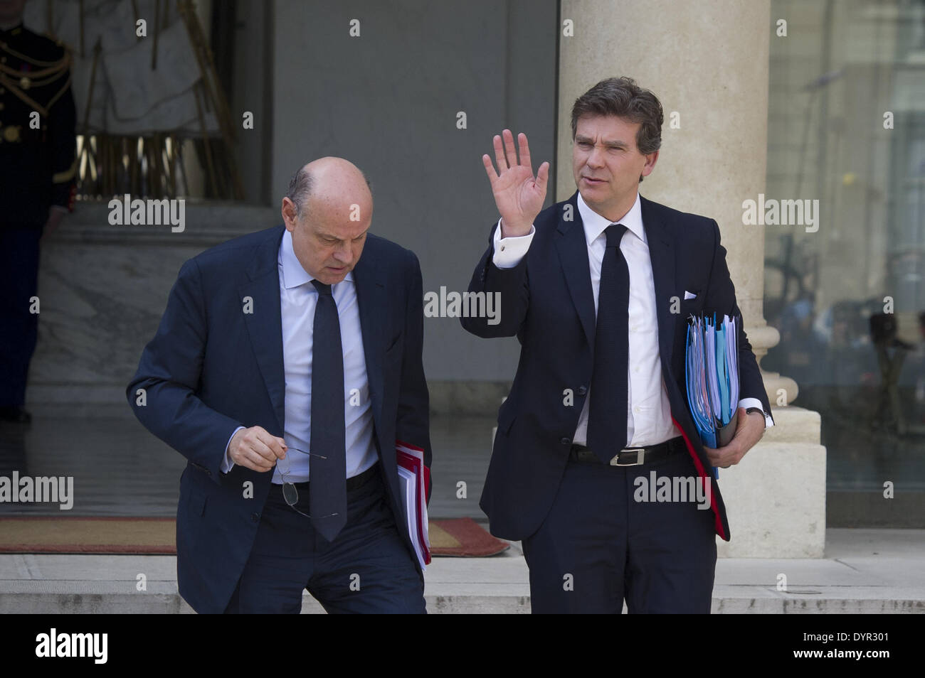 Paris, FRA. 23rd Apr, 2014. French Economy Minister Arnaud Montebourg (R) greets as he leaves the Elysee Palace in Paris with French Junior Minister for Relations with Parliament Jean-Marie Le Guen (L) leave the Elysee palace on April 23, 2014, in Paris, after the weekly cabinet meeting. (Photo/Zacharie Scheurer) © Zacharie Scheurer/NurPhoto/ZUMAPRESS.com/Alamy Live News Stock Photo