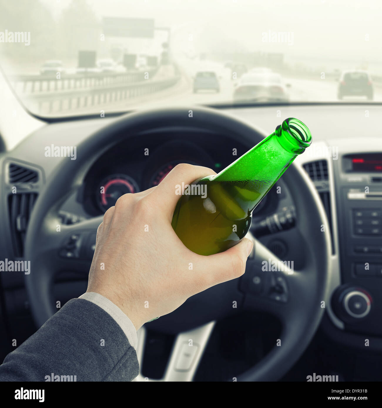Man hand holding bottle of beer while driving car - 1 to 1 ratio Stock ...