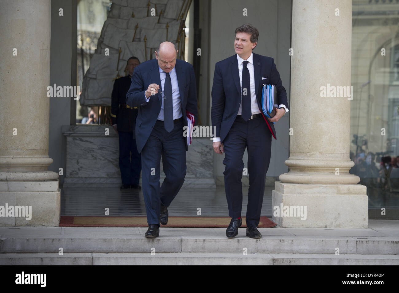 Paris, FRA. 23rd Apr, 2014. French Economy Minister Arnaud Montebourg (R) greets as he leaves the Elysee Palace in Paris with French Junior Minister for Relations with Parliament Jean-Marie Le Guen (L) leave the Elysee palace on April 23, 2014, in Paris, after the weekly cabinet meeting. (Photo/Zacharie Scheurer) © Zacharie Scheurer/NurPhoto/ZUMAPRESS.com/Alamy Live News Stock Photo