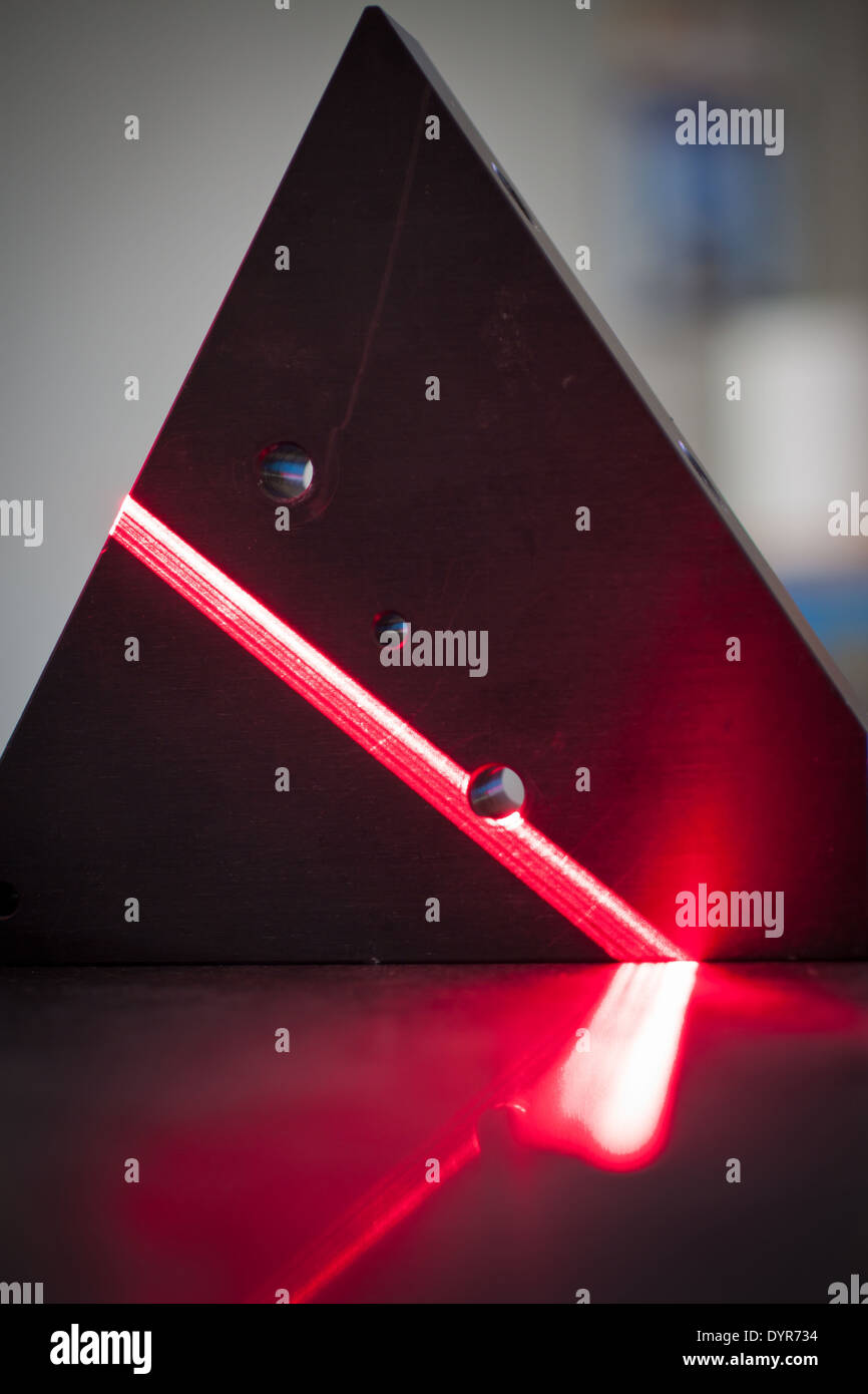 3D laser scanner the bright red laser beam scanning a surface Stock