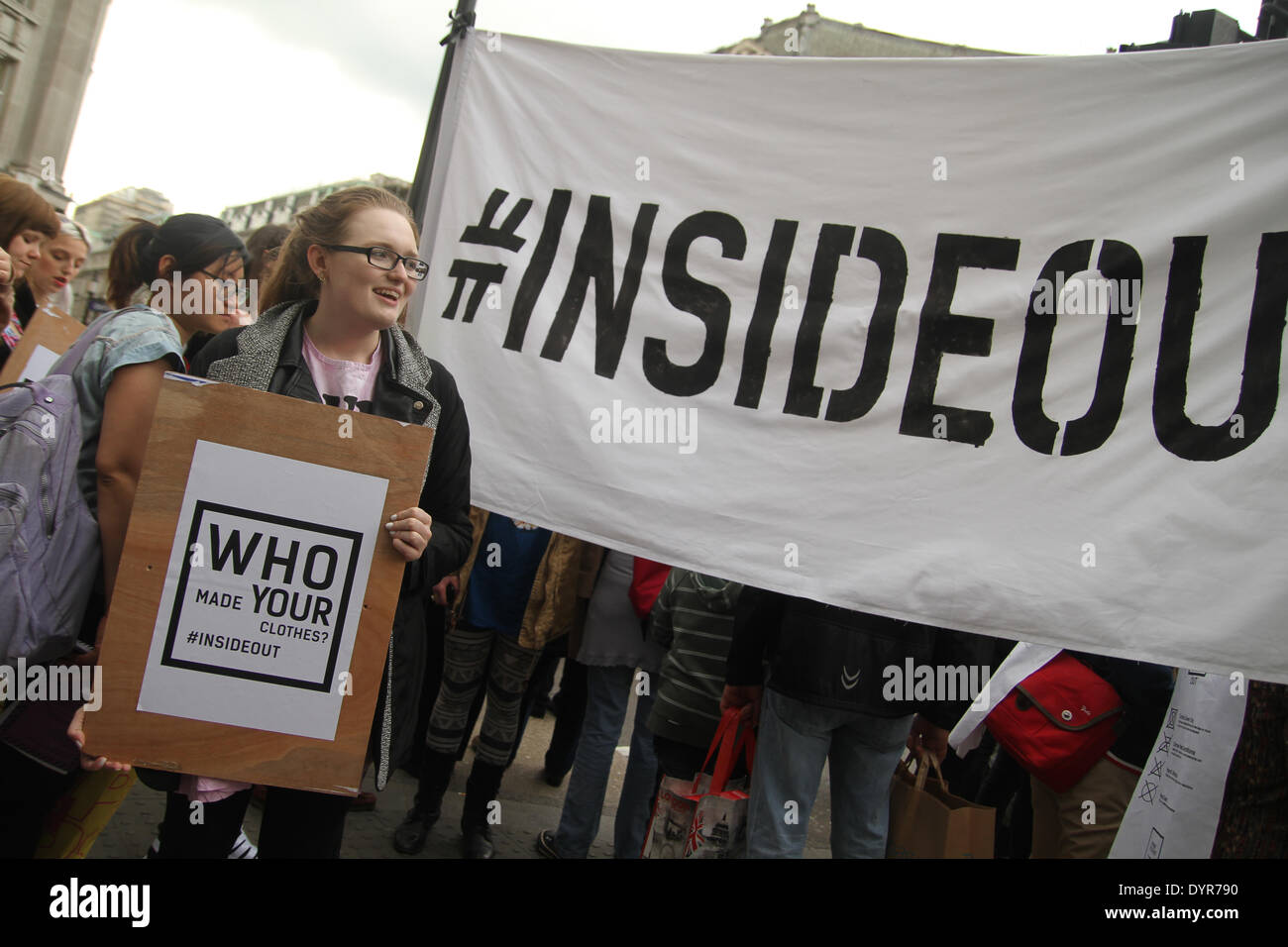 London, UK. 24th April 2014. A group of protesters carrying a banner with the words 'Inside Out' chant 'Who made your clothes' Credit:  david mbiyu/Alamy Live News Stock Photo