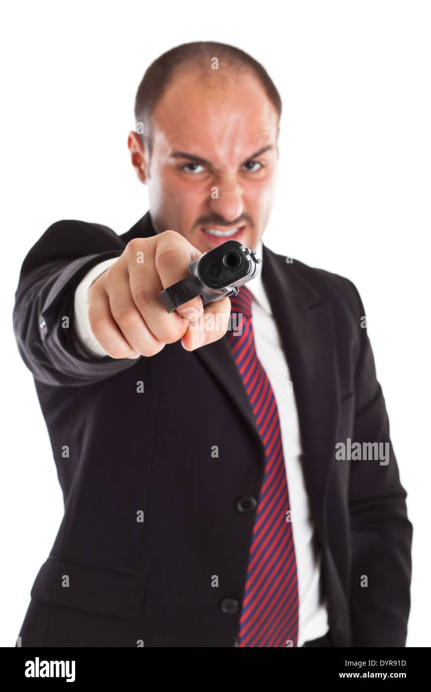 a businessman with a gun (focus on gun) Stock Photo