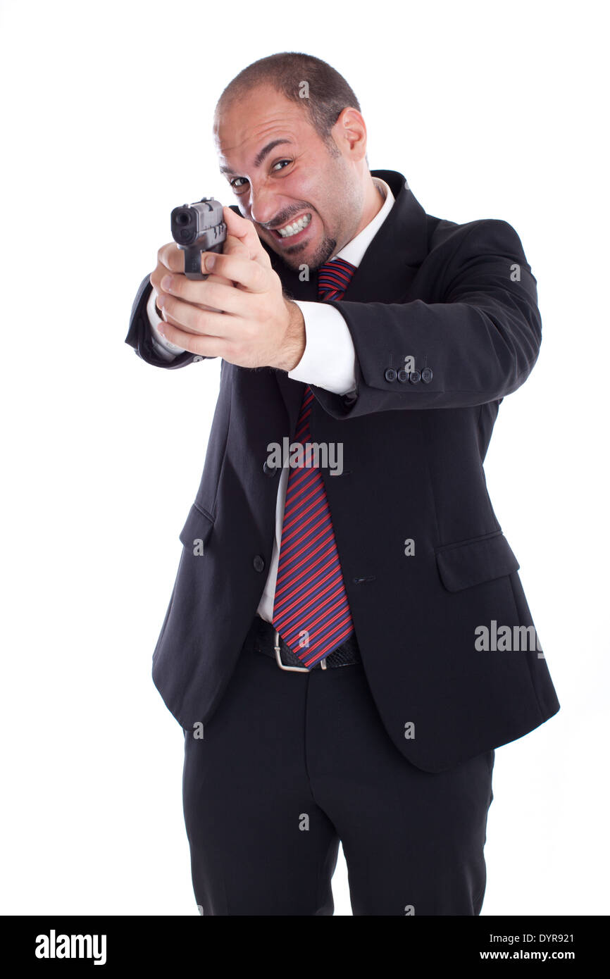 a businessman with a gun aiming at you! Stock Photo