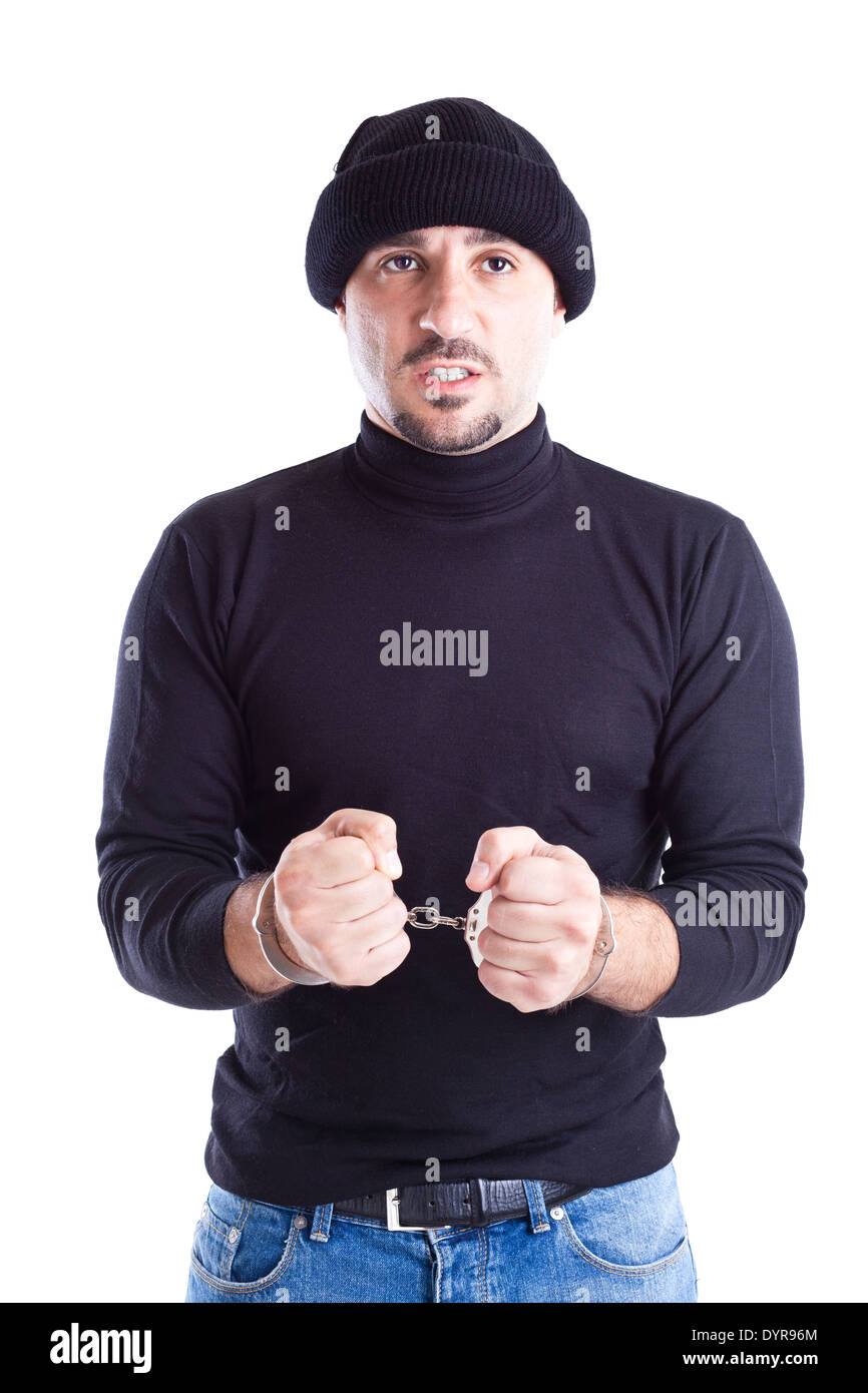a young thief or burglar with handcuffs on Stock Photo Alamy