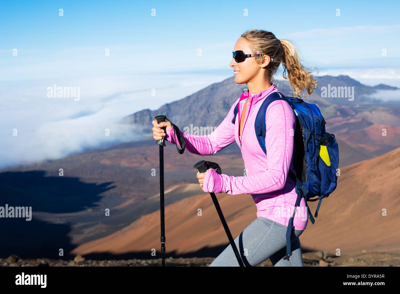 Female hiker with backpack in the mountains Stock Photo - Alamy