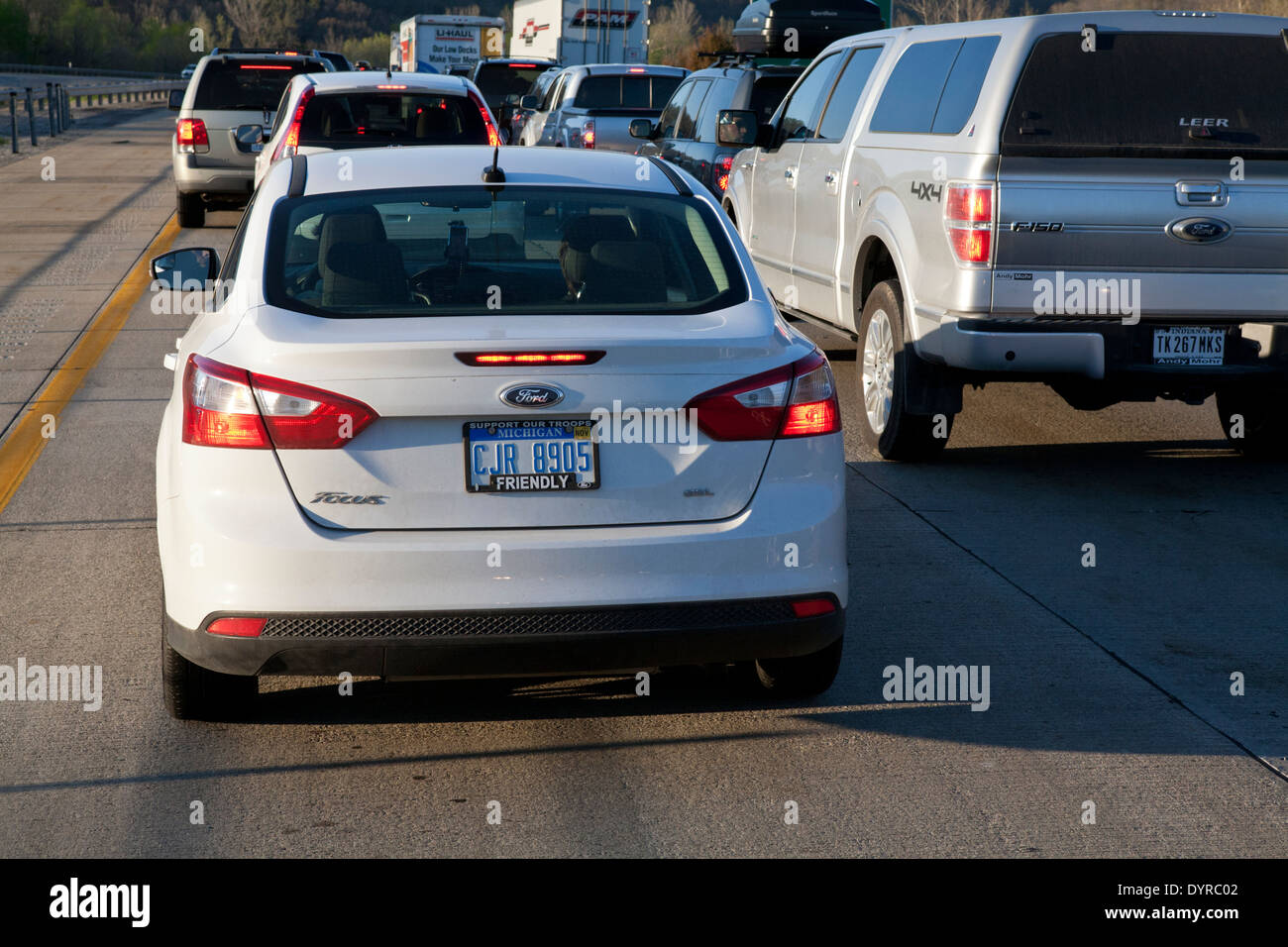 Automobiles stuck in stopped highway traffic. Stock Photo