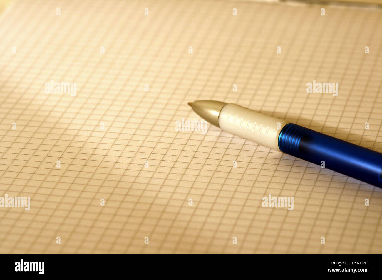 blue-white ballpoint writer on a block Stock Photo